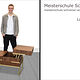 Porträt von Luca Wilm mit seinem Schreinermeisterstück "Couchtisch-Pull to open"